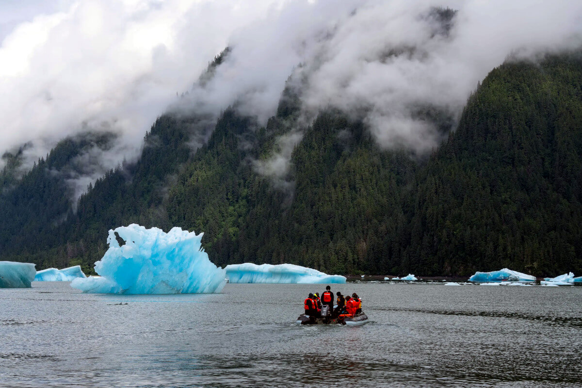 Guests aboard a skiff in LeConte Glacier National Wilderness